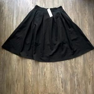 Black pleated mid length skirt